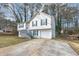 Two-story house with white siding, gray trim, and a driveway at 3446 Newberry Trl, Decatur, GA 30034