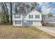 Two-story house with white siding, gray trim, and a front yard at 3446 Newberry Trl, Decatur, GA 30034