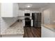 Modern kitchen with granite countertops and white cabinets at 3446 Newberry Trl, Decatur, GA 30034