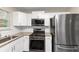 Modern kitchen with stainless steel appliances and granite countertops at 3446 Newberry Trl, Decatur, GA 30034