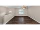Spacious living room with dark hardwood floors and a ceiling fan at 3446 Newberry Trl, Decatur, GA 30034