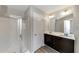Bathroom with double vanity, shower, and linen closet at 3457 Sardis Bend Dr, Buford, GA 30519