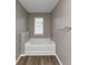 Bathroom with soaking tub and window at 3457 Sardis Bend Dr, Buford, GA 30519
