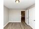 Spacious bedroom with neutral walls and wood-look flooring, open loft view at 3457 Sardis Bend Dr, Buford, GA 30519