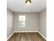 Simple bedroom with neutral walls and wood-look flooring at 3457 Sardis Bend Dr, Buford, GA 30519
