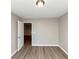 Bright bedroom featuring an open loft view and wood-look flooring at 3457 Sardis Bend Dr, Buford, GA 30519