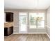 Bright dining room with hardwood floors and access to the backyard at 3457 Sardis Bend Dr, Buford, GA 30519