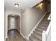 Light and airy entryway with laminate flooring and staircase at 3457 Sardis Bend Dr, Buford, GA 30519