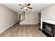 Living room with fireplace, hardwood floors and view of staircase at 3457 Sardis Bend Dr, Buford, GA 30519