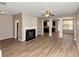 Spacious living room with hardwood floors, fireplace, and open floor plan at 3457 Sardis Bend Dr, Buford, GA 30519