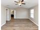 Main bedroom with ceiling fan and ensuite bathroom access at 3457 Sardis Bend Dr, Buford, GA 30519