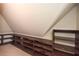 Attic featuring custom-built shelving and storage at 115 Russell Rd, Roswell, GA 30075