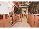 Unfinished basement space with exposed utilities and a doorway to another room at 115 Russell Rd, Roswell, GA 30075