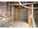 Unfinished basement with exposed framing, ductwork, and plumbing offering potential for customization at 115 Russell Rd, Roswell, GA 30075
