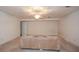Unfinished basement featuring a ceiling fan and a neutral-colored wall at 115 Russell Rd, Roswell, GA 30075
