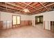 Spacious unfinished basement with exposed ceiling and natural light from the windows at 115 Russell Rd, Roswell, GA 30075