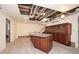 Unfinished basement with a partial bar area and built-in cabinets at 115 Russell Rd, Roswell, GA 30075