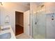 This bathroom includes a double vanity, granite counters, and stand up shower at 115 Russell Rd, Roswell, GA 30075