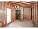 Bathroom with exposed wooden framing, a window for natural light, and a shower stall with marble interior at 115 Russell Rd, Roswell, GA 30075