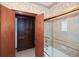 Bathroom view showing a walk-in closet and glass enclosed shower at 115 Russell Rd, Roswell, GA 30075
