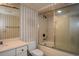 Cozy bathroom with shower-tub and classic sink, mirror, and toilet at 115 Russell Rd, Roswell, GA 30075