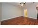 Large bedroom with hardwood floors and ceiling fan at 115 Russell Rd, Roswell, GA 30075