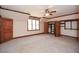 Bedroom showcasing ensuite walk-in closets, with abundant natural light at 115 Russell Rd, Roswell, GA 30075