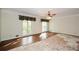 Spacious bedroom with large windows, hardwood floors, and crown molding at 115 Russell Rd, Roswell, GA 30075