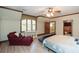 Bright bedroom with a large window and light hardwood floors at 115 Russell Rd, Roswell, GA 30075