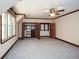 Bedroom showcasing ensuite walk-in closets, with abundant natural light at 115 Russell Rd, Roswell, GA 30075