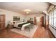 Spacious bedroom featuring hardwood floors, built-in bookshelves, and natural light at 115 Russell Rd, Roswell, GA 30075