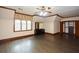 Bedroom with hardwood floors, dresser and ensuite closet at 115 Russell Rd, Roswell, GA 30075