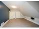 Open concept bonus room with high ceilings and plank flooring at 115 Russell Rd, Roswell, GA 30075