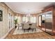 Charming breakfast nook with a round table, decorative wallpaper, and natural light at 115 Russell Rd, Roswell, GA 30075