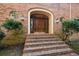Inviting front entrance with brick steps, double doors, and charming lanterns at 115 Russell Rd, Roswell, GA 30075