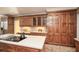 Spacious kitchen with custom wood cabinets, stainless steel appliances, and a large center island at 115 Russell Rd, Roswell, GA 30075
