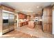Large kitchen featuring custom wood cabinets, stainless steel appliances, and ample counter space at 115 Russell Rd, Roswell, GA 30075