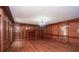 Spacious living room showcasing hardwood floors, built-in shelving, and abundant natural light at 115 Russell Rd, Roswell, GA 30075