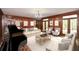 Spacious living room featuring paneled walls, hardwood floors, and comfortable seating at 115 Russell Rd, Roswell, GA 30075