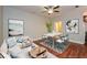 Cozy living room with an open floor plan, light blue accents, and comfortable furniture at 115 Russell Rd, Roswell, GA 30075