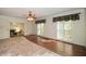 Bright living room featuring hardwood floors, crown molding, and large windows overlooking the outdoor scenery at 115 Russell Rd, Roswell, GA 30075