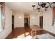 Spacious living room featuring hardwood floors, large windows, and decorative window treatments at 115 Russell Rd, Roswell, GA 30075