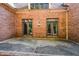 Brick patio with French doors, perfect for outdoor entertaining at 115 Russell Rd, Roswell, GA 30075