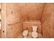 A practical powder room includes a toilet and bidet set against a decorative wallpaper and functional towel rack at 115 Russell Rd, Roswell, GA 30075
