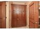 A hallway storage boasts full-length doors, crown molding, and easy access in a high-traffic area at 115 Russell Rd, Roswell, GA 30075