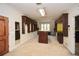 Spacious walk-in closet with custom dark wood cabinets and shelving at 115 Russell Rd, Roswell, GA 30075