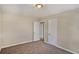 Bright bedroom with neutral walls and carpet, plus two closets and access to other rooms at 1761 Derrill Dr, Decatur, GA 30032