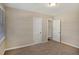 Spacious bedroom with neutral walls, carpet flooring, and ample closet space at 1761 Derrill Dr, Decatur, GA 30032
