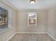 Simple dining area with neutral colored walls and tile flooring at 1761 Derrill Dr, Decatur, GA 30032