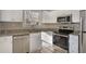 Updated kitchen with stainless steel appliances and granite countertops at 1761 Derrill Dr, Decatur, GA 30032